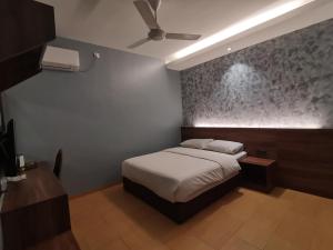 Voodi või voodid majutusasutuse Lumut Hotel toas