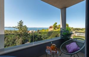 a balcony with a view of the ocean at 3 Bedroom Awesome Apartment In Kozino in Kožino