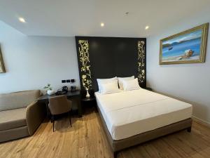 Postel nebo postele na pokoji v ubytování Arka Art Hotel