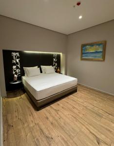 Postel nebo postele na pokoji v ubytování Arka Art Hotel
