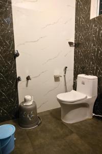 a bathroom with a toilet in a room at Fort Kochi Paradise Homestay in Fort Kochi +12 photos