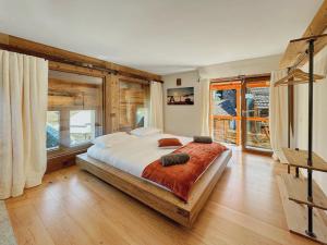 Postel nebo postele na pokoji v ubytování Pilanous House - Penthouse suite - Swiss Alps