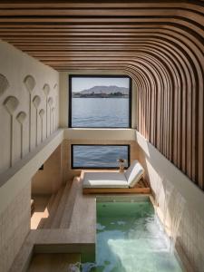 a bathroom with a plunge pool and a window at Soleil Nile Cruise - Every Monday from Luxor for 4 & 7 Nights, and every Friday from Aswan for 3 & 7 Nights in Luxor