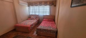 A bed or beds in a room at CozyHome 3BR Place Nasr City