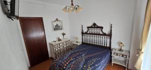 Ένα ή περισσότερα κρεβάτια σε δωμάτιο στο Casa do Neto Tiago