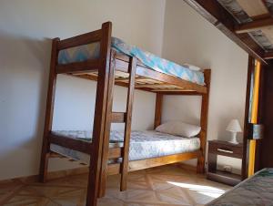a bedroom with two bunk beds in a room at Los Poin 2 in Mar de Cobo