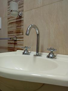 a white sink with a faucet in a bathroom at Los Poin 2 in Mar de Cobo +99 photos