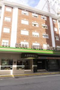 a building with a sign that reads grand hotel at Gran Hotel Augusto in Mar del Plata