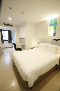 Postel nebo postele na pokoji v ubytování Go Hotels Ortigas Center