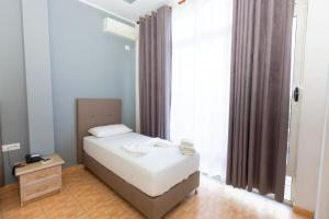 Postel nebo postele na pokoji v ubytování Hotel Triada + 15 fotografií