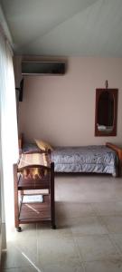 En eller flere senge i et værelse på Alma Dulce + 2 billeder