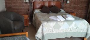 En eller flere senge i et værelse på Alma Dulce