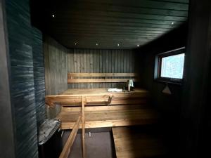 an empty sauna with a bench in a room at Hillside Cottage in Ivalo