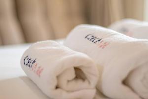 a roll of white towels on a table at CzechinProperties New Listing Sea View in Ras al Khaimah