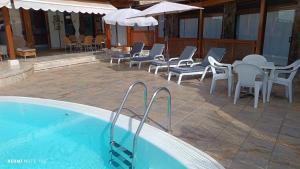 Bazén v ubytovaní ANFI TOPAZ VILLA TAURO GOLF & BEACH 3 bedrooms 4 bathrooms private pool alebo v jeho blízkosti