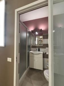 a bathroom with a toilet and a sink at Appartamento San Vito in Piana degli Albanesi