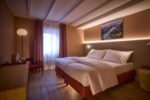 Ένα ή περισσότερα κρεβάτια σε δωμάτιο στο Cà Nani Small Boutique Hotel +52 φωτογραφίες