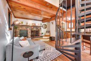 a living room with a couch and a fireplace at Patio and Mtn Views Peaceful Sedona Retreat in Sedona