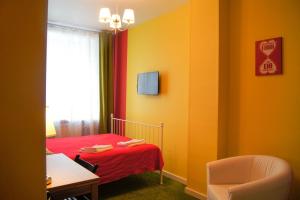 En eller flere senge i et værelse på Mini-Hotel Spi Zdes