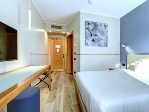 Ένα ή περισσότερα κρεβάτια σε δωμάτιο στο B&B Hotel Quarto d'Altino