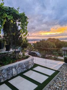 a view of a sunset from a house at Apartment Aria in Lovran