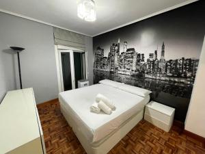 Ένα ή περισσότερα κρεβάτια σε δωμάτιο στο Encantador apartamento en el centro de Castro CON PARKING