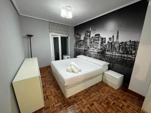 Ένα ή περισσότερα κρεβάτια σε δωμάτιο στο Encantador apartamento en el centro de Castro CON PARKING +11 φωτογραφίες