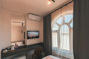 TV a/nebo společenská místnost v ubytování Dastan Hotel Baku