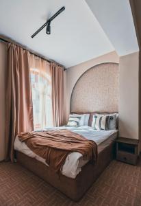 Postel nebo postele na pokoji v ubytování Dastan Hotel Baku