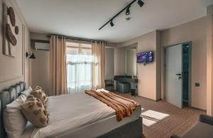 Postel nebo postele na pokoji v ubytování Dastan Hotel Baku
