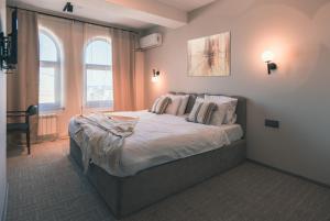 Postel nebo postele na pokoji v ubytování Dastan Hotel Baku