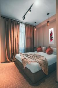 Postel nebo postele na pokoji v ubytování Dastan Hotel Baku