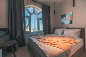 Postel nebo postele na pokoji v ubytování Dastan Hotel Baku