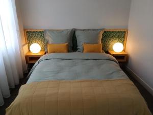 Katil atau katil-katil dalam bilik di Appartement au cœur de la Petite Cité de Caractère