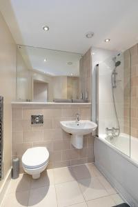 a bathroom with a toilet and a sink and a shower at 30 Quayside Newcastle in Newcastle upon Tyne +38 photos