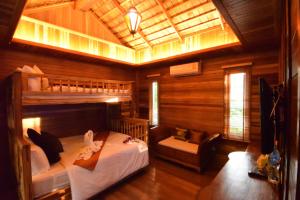a bedroom with a bunk bed in a cabin at Villa Habeebee in Ao Nang Beach