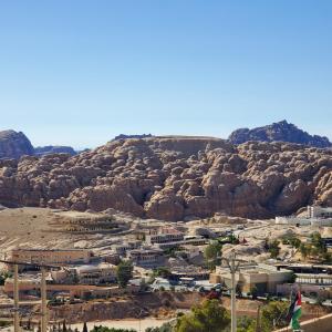 a town in front of a rocky mountain at Summit Hotel in Petra