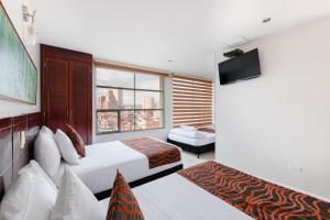 Postel nebo postele na pokoji v ubytování Hotel Parque 63 + 26 fotografií
