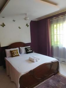 Postel nebo postele na pokoji v ubytování Palm Escape Diani Beach - Holiday Homes