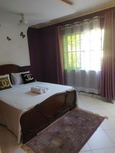 Postel nebo postele na pokoji v ubytování Palm Escape Diani Beach - Holiday Homes + 25 fotografií