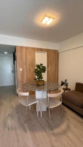 a room with a table and chairs and a couch at MC Apartments Recoleta - Guido in Buenos Aires