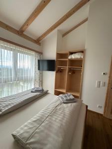 Rúm í herbergi á Appartement Weitblick