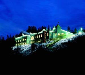 a large building at night with lights at Hotel Royal Ruka in Ruka