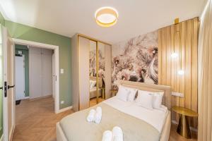 Postel nebo postele na pokoji v ubytování POSESJA APARTAMENTY & SPA - Posesja Plażowa 4a II + 41 fotografií