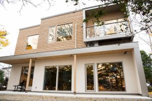 a house with large windows on top of it at La Cachette in Hakodate