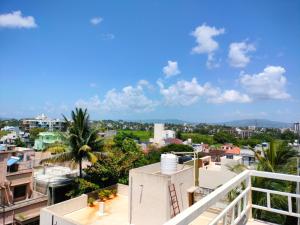 a view of a city from the balcony of a building at SRUSHTI The Peace Home HOME STAY in Kolhapur
