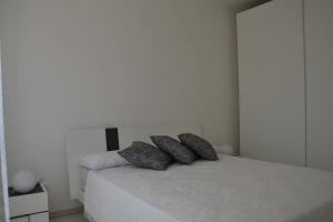 Posteľ alebo postele v izbe v ubytovaní Alba Apartment - Villaggio di Mary + 20 fotografií