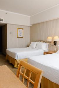 Postel nebo postele na pokoji v ubytování Intercity Tower Hotels