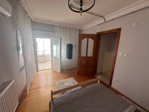a room with a hallway with a bed and a door at Bike Hub Şile in Sile