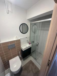 a bathroom with a toilet and a sink and a shower at Bike Hub Şile in Sile